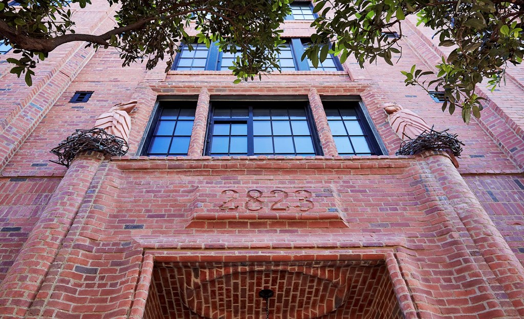 A red brick building with the number 2823 on it.